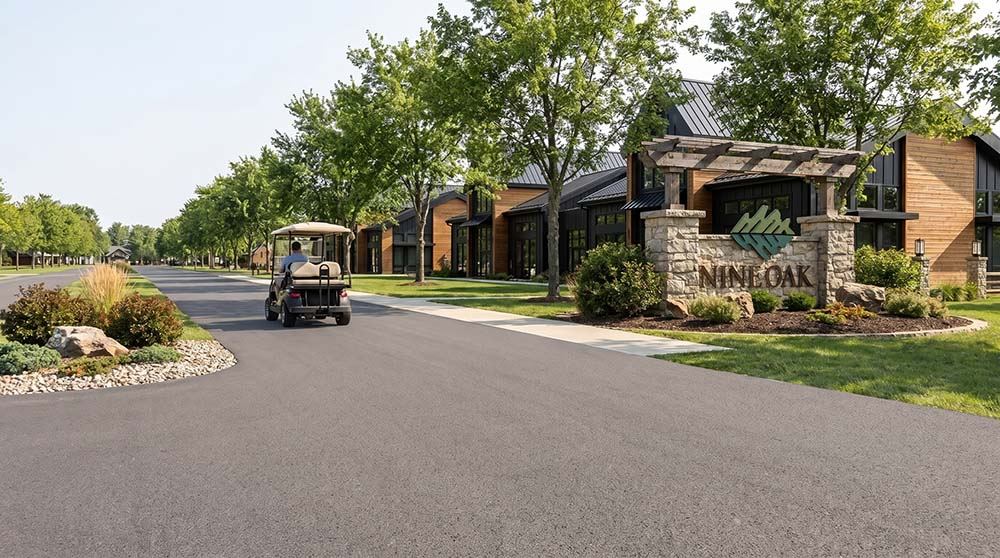 Nine-Oak-Entry_20260626-sm-optimized golf card driving through the community