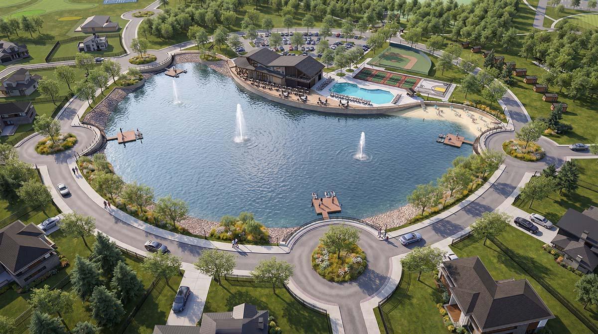 NineOak-Birdseye-View-Looking-NW-optimized aerial view of town center featuring large pond with two fountains.